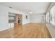 Open concept living area with light wood floors, kitchen access and natural light at 11762 82Nd Ter, Seminole, FL 33772