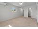 Comfortable main bedroom with natural light, carpet, and a bathroom at 11762 82Nd Ter, Seminole, FL 33772