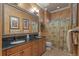 Bathroom with granite countertops, a double sink vanity, decorative wall accents, and a shower with a curtain at 11817 Glen Wessex Ct, Tampa, FL 33626