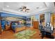 Spacious bedroom with golf themed decor and mural at 11817 Glen Wessex Ct, Tampa, FL 33626