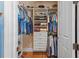 Walk-in closet with custom shelving and ample storage space for clothes and shoes at 11817 Glen Wessex Ct, Tampa, FL 33626