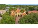 Aerial front view of a stunning two-story home with lush landscaping and a circular driveway at 11817 Glen Wessex Ct, Tampa, FL 33626
