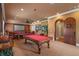 Entertaining game room showcases a pool table, projection screen, and comfortable seating at 11817 Glen Wessex Ct, Tampa, FL 33626