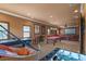 Spacious game room boasts a pool table, air hockey, foosball, and home theater setup at 11817 Glen Wessex Ct, Tampa, FL 33626