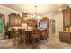Elegant kitchen featuring custom wood cabinetry, granite countertops, and a center island with seating at 11817 Glen Wessex Ct, Tampa, FL 33626