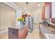 Bright kitchen with a center island, stainless steel refrigerator, and plenty of counter space at 11817 Glen Wessex Ct, Tampa, FL 33626
