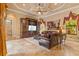 Inviting living room with coffered ceilings, custom wood entertainment center, and natural light at 11817 Glen Wessex Ct, Tampa, FL 33626