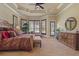 Spacious main bedroom with a tray ceiling, ample natural light, and a sitting area at 11817 Glen Wessex Ct, Tampa, FL 33626