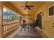 Covered patio featuring comfortable seating and an overhead fan for relaxed outdoor living at 11817 Glen Wessex Ct, Tampa, FL 33626