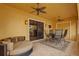Inviting covered patio with stylish seating, ceiling fans, and access to the indoors at 11817 Glen Wessex Ct, Tampa, FL 33626