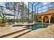 Beautiful backyard pool with covered lanai, spa, and waterfront views at 11817 Glen Wessex Ct, Tampa, FL 33626