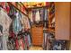 Well-organized walk-in closet with shelving, drawers, and ample hanging space for storage at 11817 Glen Wessex Ct, Tampa, FL 33626