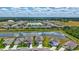 Gorgeous aerial view of new homes in a community surrounding a beautiful pond at 12710 Hysmith Loop, Parrish, FL 34219