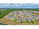 Aerial view showing house location in a sprawling community and picturesque surroundings near pond at 12710 Hysmith Loop, Parrish, FL 34219