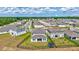 An aerial perspective showcases the expansive fenced backyard, complemented by neighborhood views of the lovely community at 12710 Hysmith Loop, Parrish, FL 34219