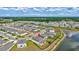 Beautiful aerial view of community featuring modern homes with backyard fences and a serene lake at 12710 Hysmith Loop, Parrish, FL 34219
