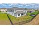 Aerial rear view of home showing the large fenced backyard, patio, and landscaping within a well-planned community at 12710 Hysmith Loop, Parrish, FL 34219