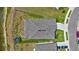 Aerial view of a landscaped property featuring a spacious driveway, a large backyard, and lake view at 12710 Hysmith Loop, Parrish, FL 34219