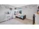 Charming bedroom decorated with Winnie the Pooh decor and a view of the outdoors at 12710 Hysmith Loop, Parrish, FL 34219