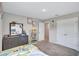 Bedroom with gray walls, a dresser, and a closet at 12710 Hysmith Loop, Parrish, FL 34219