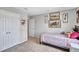 Carpeted bedroom with natural light featuring a closet, a full-sized bed, and horse artwork creating a cozy space at 12710 Hysmith Loop, Parrish, FL 34219