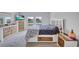 The bedroom features a decorative headboard, lots of drawer space and a large TV at 12710 Hysmith Loop, Parrish, FL 34219