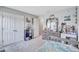 Bedroom featuring gray walls, carpet, double closet, and a large window at 12710 Hysmith Loop, Parrish, FL 34219