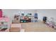 Large bonus room with toys and plenty of play space at 12710 Hysmith Loop, Parrish, FL 34219