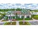 Charming clubhouse with stone accents, professional landscaping, and mature palm trees at 12710 Hysmith Loop, Parrish, FL 34219