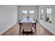 Well-lit dining room with a large table set for ten, offers scenic backyard views at 12710 Hysmith Loop, Parrish, FL 34219