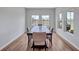 Formal dining room with a large table, plenty of seating, and a view of the lake at 12710 Hysmith Loop, Parrish, FL 34219