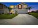 Charming two-story home with a well-manicured lawn and spacious driveway at 12710 Hysmith Loop, Parrish, FL 34219