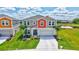 Charming two-story home with a pond view, and well-manicured lawn at 12710 Hysmith Loop, Parrish, FL 34219