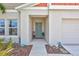 Inviting front porch with detailed trim and front door at 12710 Hysmith Loop, Parrish, FL 34219