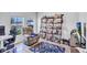 Cozy living room area featuring a liquor display, chair, and natural lighting at 12710 Hysmith Loop, Parrish, FL 34219