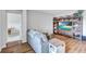 Comfortable living room with cozy seating and a large entertainment center provides a welcoming atmosphere at 12710 Hysmith Loop, Parrish, FL 34219