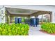 Community mailboxes are sheltered under modern structure with lush greenery, offering convenient and scenic feature at 12710 Hysmith Loop, Parrish, FL 34219