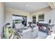 Inviting patio with outdoor seating and BBQ area, ideal for relaxing and grilling with scenic views at 12710 Hysmith Loop, Parrish, FL 34219
