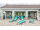 Relaxing pool area with lounge chairs and seating under a covered pavilion, perfect for enjoying sunny days at 12710 Hysmith Loop, Parrish, FL 34219