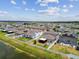 Aerial view of the community's fenced backyards near a pond; great for families or those who like to entertain at 13529 Wild Ginger St, Riverview, FL 33579