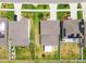This aerial view highlights the homes well-kept landscaping, driveway and attached garage at 13529 Wild Ginger St, Riverview, FL 33579
