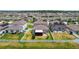 An aerial view of a well-planned community highlighting the fenced backyards at 13529 Wild Ginger St, Riverview, FL 33579