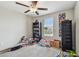 A bedroom with a window and built-in shelving, offering plenty of natural light at 13529 Wild Ginger St, Riverview, FL 33579