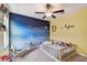 Bright bedroom with a crib, unique celestial accent wall, and ample natural light at 13529 Wild Ginger St, Riverview, FL 33579