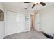 A bedroom featuring a closet with double doors and a neutral color scheme at 13529 Wild Ginger St, Riverview, FL 33579