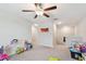 Bright bonus room featuring carpet, ceiling fan, and neutral paint at 13529 Wild Ginger St, Riverview, FL 33579