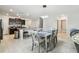 Open-concept dining area features tile floors and a stylish light fixture, and is open to the kitchen at 13529 Wild Ginger St, Riverview, FL 33579