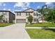 Charming two-story home features well-manicured landscaping, a spacious driveway, and a two-car garage at 13529 Wild Ginger St, Riverview, FL 33579