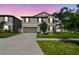 Charming two-story home features well-manicured landscaping, a spacious driveway, and a two-car garage at 13529 Wild Ginger St, Riverview, FL 33579