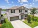 A two story home featuring an attached two car garage and well-manicured front lawn at 13529 Wild Ginger St, Riverview, FL 33579